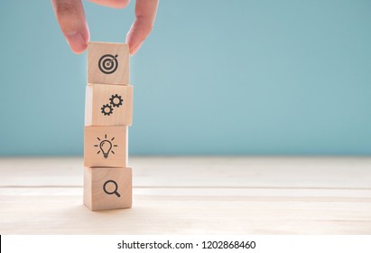 Businessman Hand Arranging Wood Block With Icon Business Strategy And Action Plan, Copy Space.