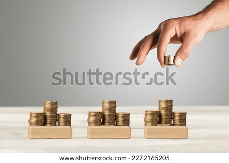 Businessman hand with coins for investment concept
