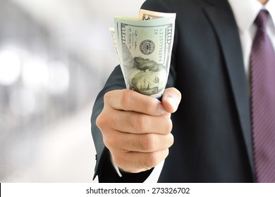 Businessman Hand Grabbing Money, US Dollar (USD) Bills