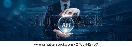 Businessman hand hold API integration on digital interface and global network. cloud-based software connectivity, application development tools, data exchange management, seamless platform integration