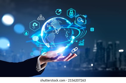 Businessman hand hold earth globe hologram, New York skyline on background, digital icons and connection. Concept of digital marketing and management