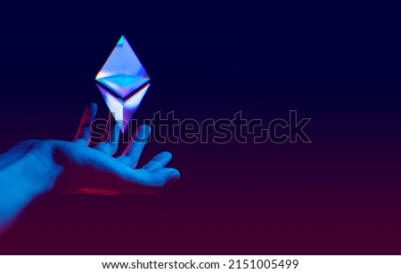 businessman hand holding bitcoin network icon on black background, metaverse internet social online technology, digital cryptocurrency coin