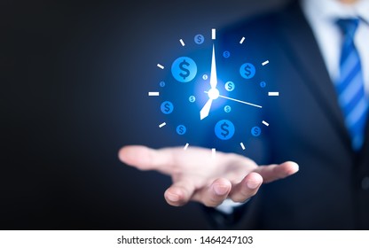 Businessman hand holding clock and money icon, Business time management and business time is money concepts - Shutterstock ID 1464247103
