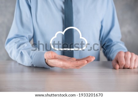Businessman hand holding cloud.Cloud computing concept, close up of young business man with cloud over his hand.The concept of cloud service