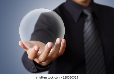 Businessman Hand Holding A Glass Ball