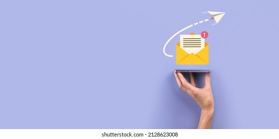 Businessman hand holding letter icon,email icons.Contact us by newsletter email and protect your personal information from spam mail.Customer service call center contact us.Email marketing newsletter - Shutterstock ID 2128623008