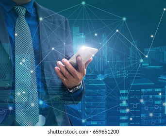 Businessman hand holding mobile phone with flying digital data network in his hand 3D rendering, double exposure, business technology and Social Network concept - Shutterstock ID 659651200