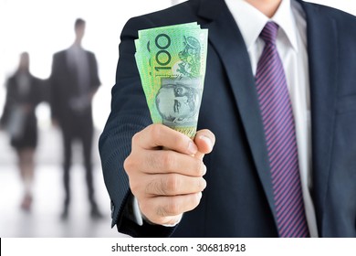 Businessman Hand Holding Money, Australian Dollar (AUD) Banknotes