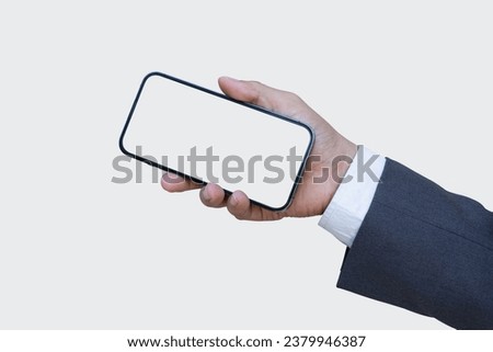Businessman hand holding smartphone with blank screen isolated onwhite background with clipping path.