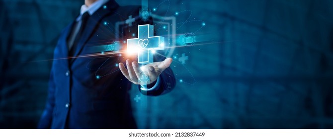 Businessman hand holding virtual medical health care icons with medical shield and network connection. People health care awareness rising growth of medical health and life insurance business. - Shutterstock ID 2132837449