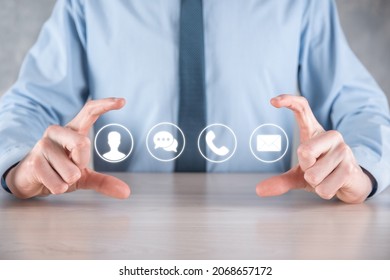 Businessman hand holding,pressing on icon phone, mail, telephone,message,post and person,user. Customer service call center contact us concept.Banner,copy space.Contact Methods - Shutterstock ID 2068657172
