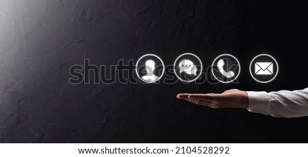 Businessman hand holding,pressing on icon phone, mail, telephone,message,post and person,user. Customer service call center contact us concept.Banner,copy space.Contact Methods