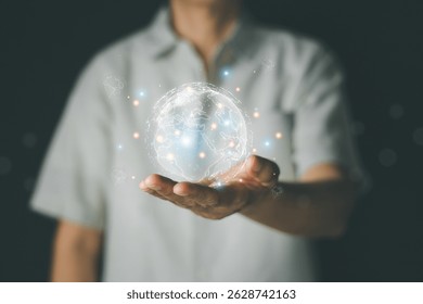 Businessman hand holds world map point and line bright, colorful lights emanate from various points on the Earth's surface. Big data, Cloud Computing analytics and business intelligence concept.
