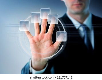 Businessman hand on a future touch screen