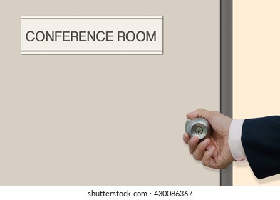 Businessman Hand Opening The Door Of Room With Label 