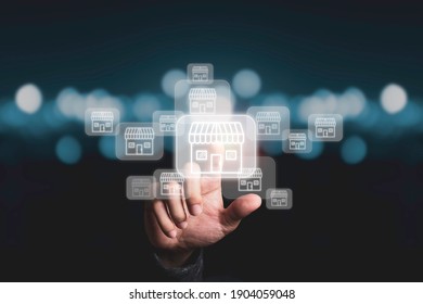 Businessman Hand Pointing To Virtual Shopping Store Which Connection Line With Others Small Shopping Stores , Expand And Development Franchise Concept.