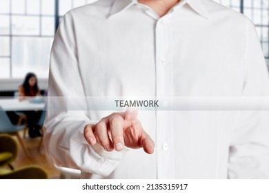 Businessman Hand Presses Teamwork Button On A Virtual Touch Screen. Business Team, Collaboration Or Teamwork Concept.
