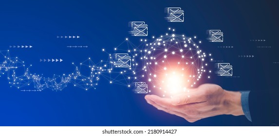 Businessman hand pressing smartphone for sending the e-mail from the laptop computer, Email and SMS marketing concept. Scheme of direct sales in business. List of clients for mailing. - Shutterstock ID 2180914427