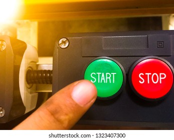 Businessman Hand Pressing Start Button With Stop Button On The Machinery In The Factory Industrial Just Get Started Business Concept.