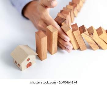 businessman hand protect home, insurance concept - Shutterstock ID 1040464174
