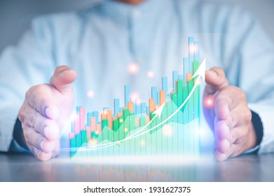 Businessman hand show Stock chart showing rising stock sign with graph indicator. Interest rate financial and mortgage rates concept. Double Exposure Image.
