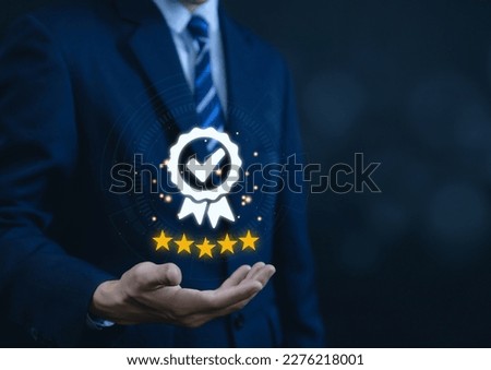 Businessman hand showing check mark digital technology icon symbol. Best quality assurance service concept, product performance assurance, and industry-leading ISO certification.