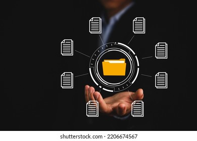 Businessman Hand Showing Electronic Document Management Icon. Concept Of Efficient Access To A Corporate Business Online Document Database. Internet File System Paperless Office On Digital Technology