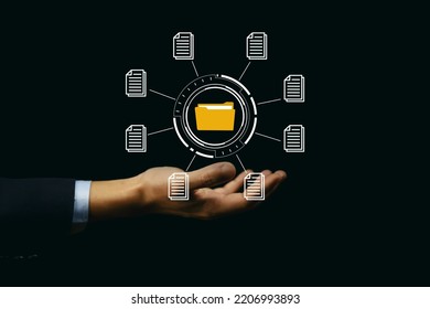 Businessman Hand Showing Electronic Document Management Icon. Concept Of Efficient Access To A Corporate Business Online Document Database. Internet File System Paperless Office On Digital Technology