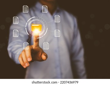 Businessman Hand Showing Electronic Document Management Icon. Concept Of Efficient Access To A Corporate Business Online Document Database. Internet File System Paperless Office On Digital Technology