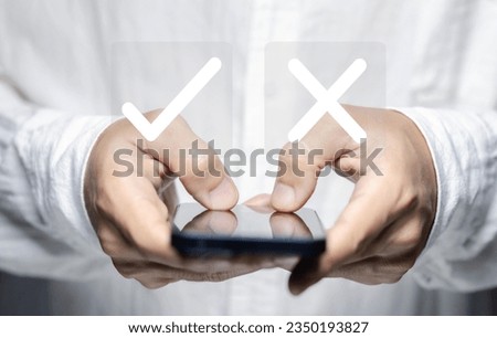 Businessman hand showing right and wrong symbol The idea is to decide to vote. Think yes or no decisions, and business options for difficult situations. true and false symbols agreeing