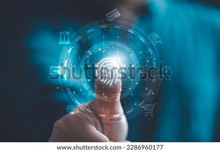 Businessman hand thumb rise up with virtual finger print and tech icon including cloud computing mobile banking and computer laptop for technology security and identity password concept.