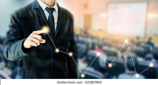 Businessman Hand Touch Virtual Chart Business, Abstract Blurred Of Conference Hall Or Seminar Room With Attendee Background, Double Exposure.