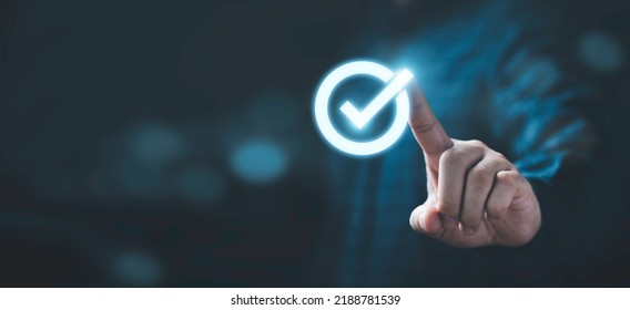 Businessman Hand Touching Glowing Correct Sign Mark With Copy Space Area For Document Approval And Project Approve Concept.