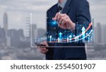 Businessman hand touching graph and arrow chart. Financial business and economic planning marketing using strategy of wealth management stability to growth.