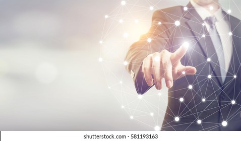 Businessman hand touching map point, network connection, international meaning, copy space - Powered by Shutterstock