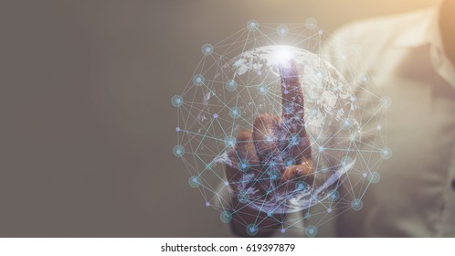 Businessman hand touching map point, network connection, international meaning, copy space / this image furnished by NASA  / soft focus picture / Vintage concept