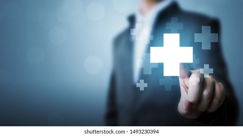 Businessman hand touching plus sign icon means to offer positive thing (like benefits, personal development, social network) - Shutterstock ID 1493230394