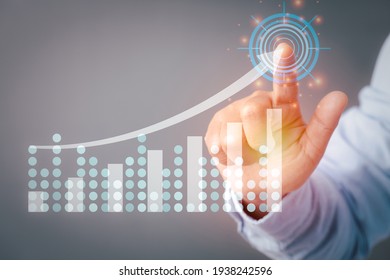 Businessman hand touching presenting sustainable arrow graph or chart coporate technology plan business development to growth and success concept.