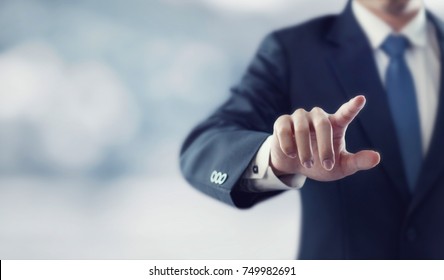 Businessman hand touching virtual screen, modern background concept , can put your text at the finger, copy space - Shutterstock ID 749982691