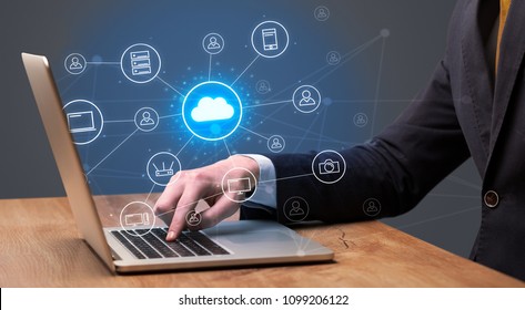Businessman hand typing with cloud technology system and office symbol concept - Shutterstock ID 1099206122
