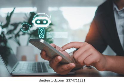Businessman hand use show a smartphone to type live chat, ask, answer with an artificial intelligence system. chatbot. Ai assistant.