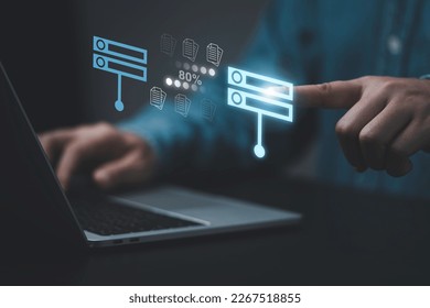 Businessman hand using laptop computer with data host server storage icon for information exchange and transfer concept.