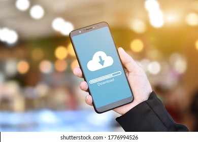 Businessman Hand Using Mobile Phone With Cloud Download Form Stored Data.