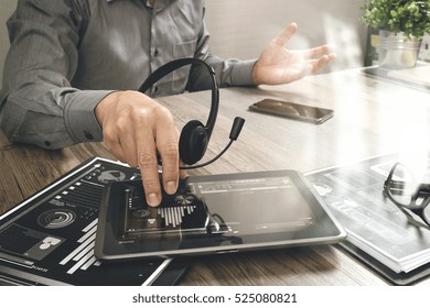 Businessman Hand Using VOIP Headset With Digital Tablet Computer,document,concept Communication, It Support, Call Center And Customer Service Help Desk,filter Effect
