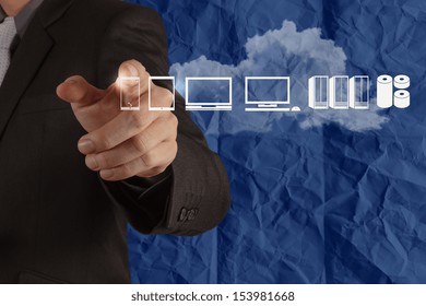 Businessman hand working with a Cloud Computing diagram on blue crumpled paper background as concept