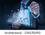 businessman hand working with new modern computer and business strategy as concept