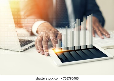 businessman hand working with new modern computer, smartphone and business strategy as concept. - Shutterstock ID 736790485