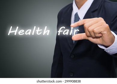 Businessman Hand Write A Health Fair