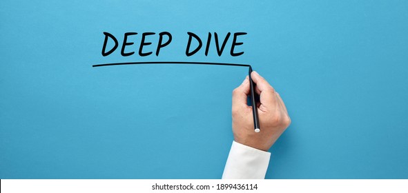 Businessman hand writing the business buzzword deep dive on blue background. - Powered by Shutterstock