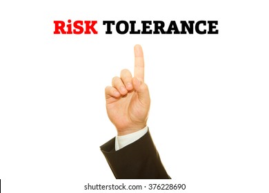 Businessman Hand Writing Risk Tolerance On A Transparent Wipe Board